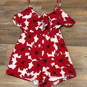 Red floral romper ruffle top with adjustable straps and peek a boo tie front